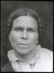 Black-and-white portrait of a woman facing the camera